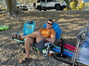 Emile sitting rocky beach ac0cb9ef