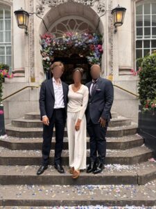 male female couple outside steps of house